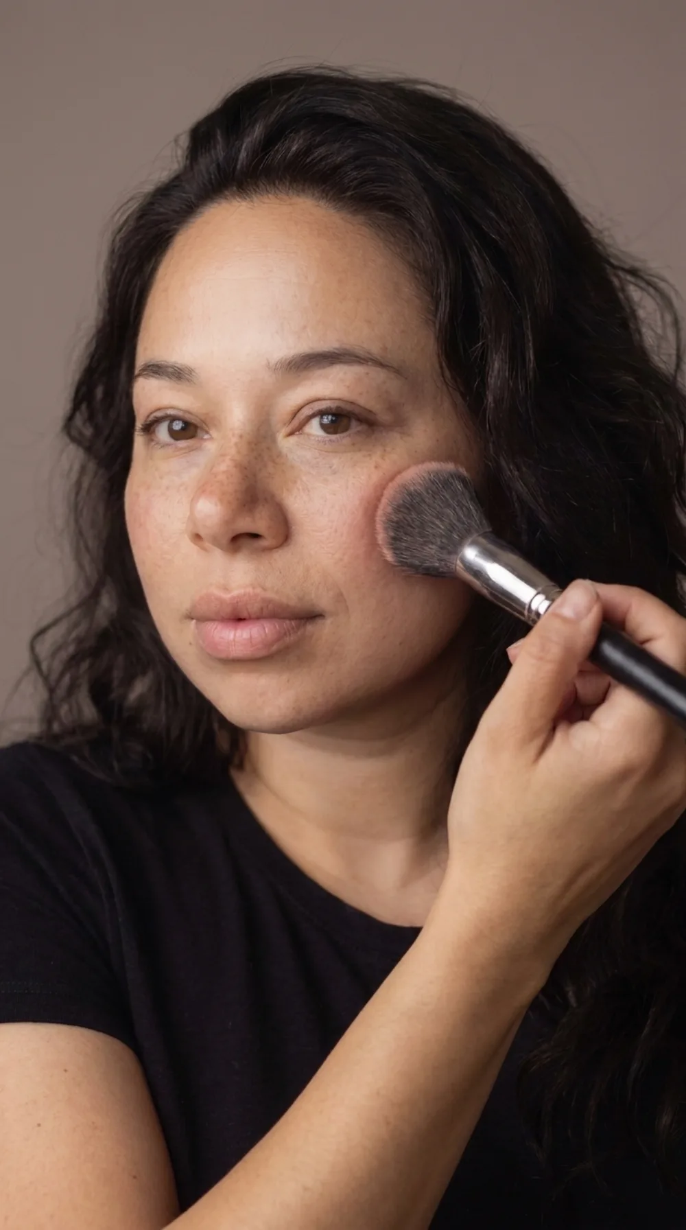 Woman applying her own makeup, a self-makeup guide by Pucca Diana